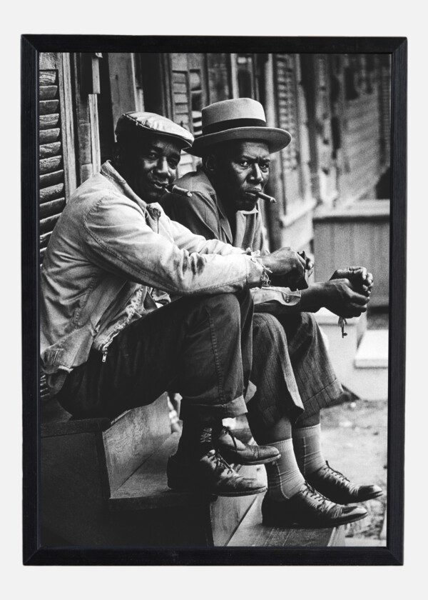 TWO AFRICAN AMERICAN MEN SITTING ON STOOP, CHARLESTON, SOUTH CAROLINA 1962