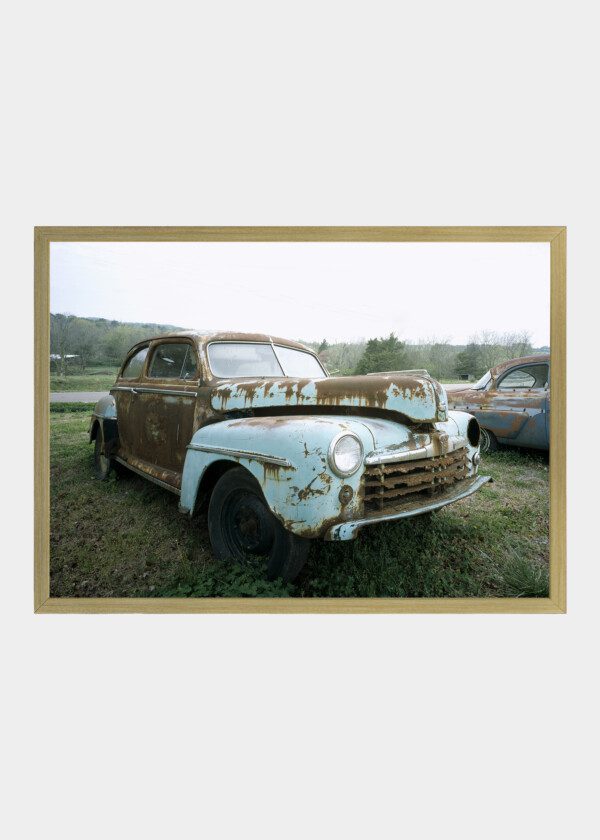 ABANDONED CAR ALONG THE ROAD IN SOUTHERN UNITED STATES