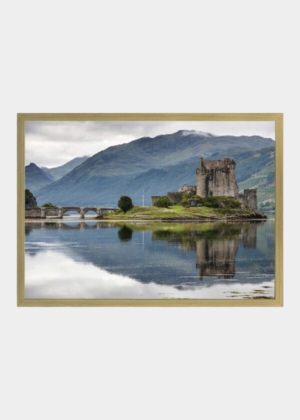 CASTLE ON AN ISLAND IN A LAKE AMONG THE MOUNTAINS