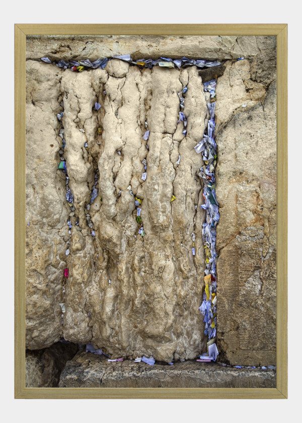 WRITTEN PRAYERS INTO THE CREVICES OF THE HOLY WALL