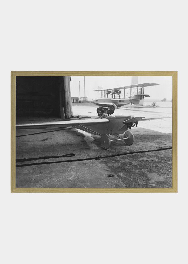 CHILD SEATED IN SMALL AIRPLANE,1924