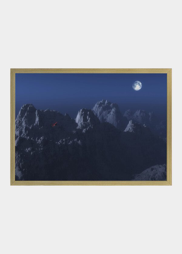 RED AIRPLANE AGAINST BLUE MOUNTAINS