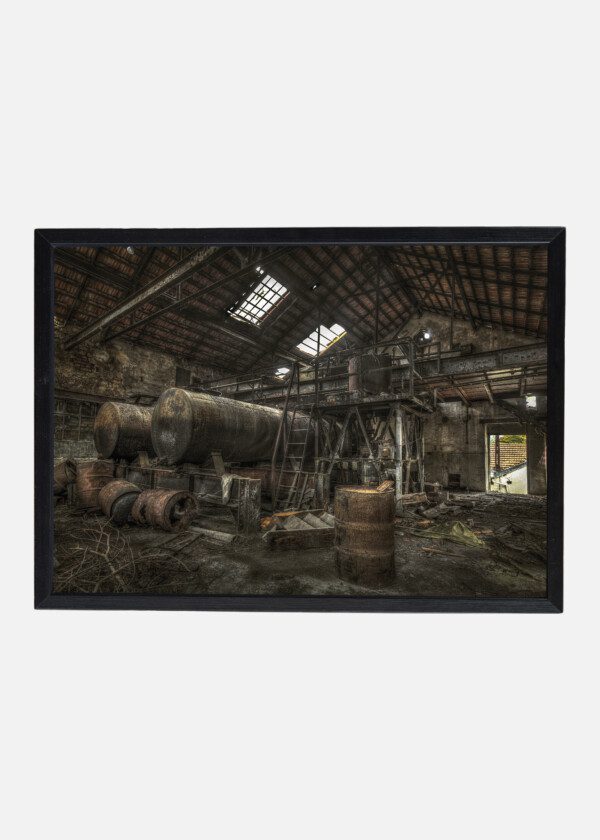 RUSTY CISTERNS AND BARRELS IN AN ABANDONED FACTORY