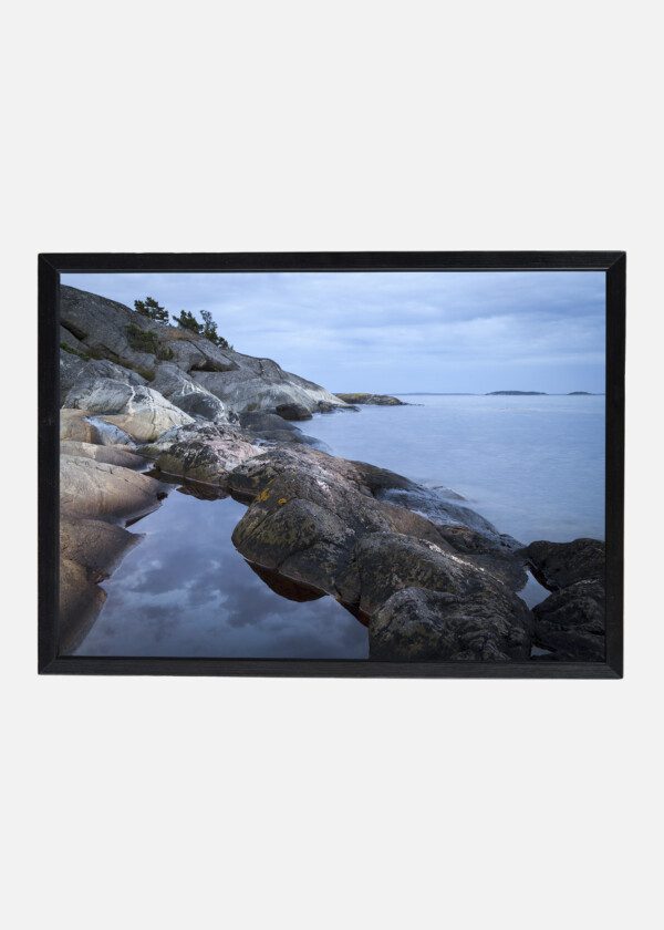 ROCK CAVES AT THE BEACH EDGE