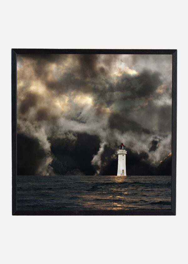 LIGHTHOUSE UNDER DARK CLOUDS