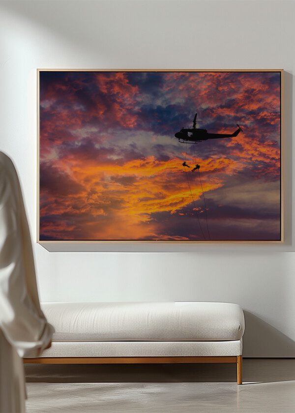HELICOPTER AGAINST RED SKY