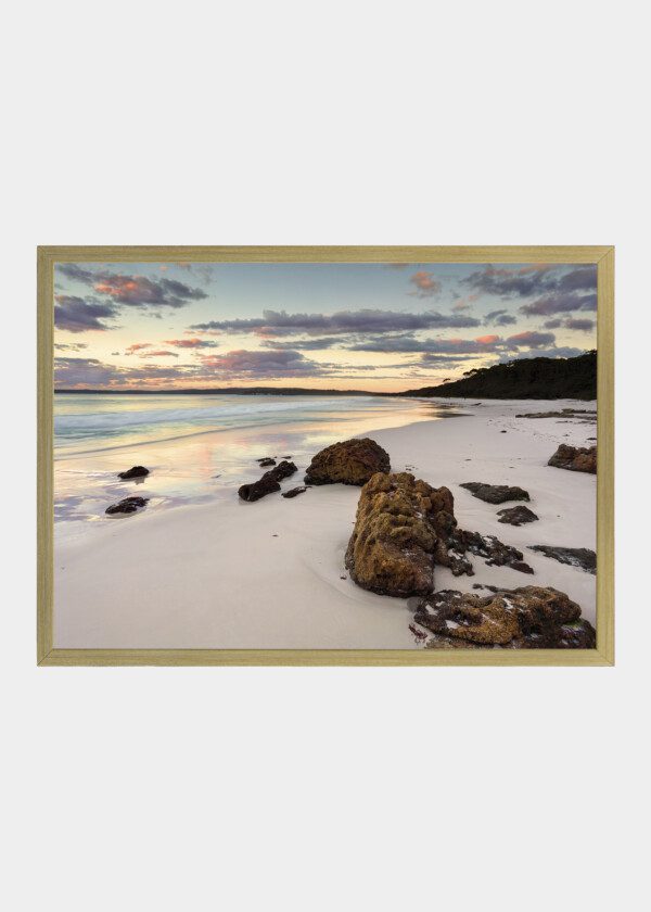 ROCKS ON SNOWY BEACH