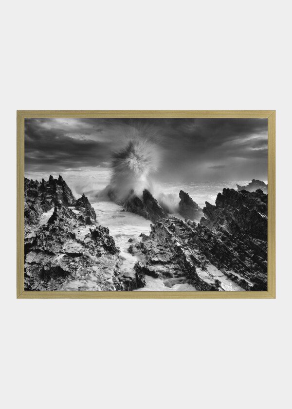 WAVES AGAINST ROCKY SHORE