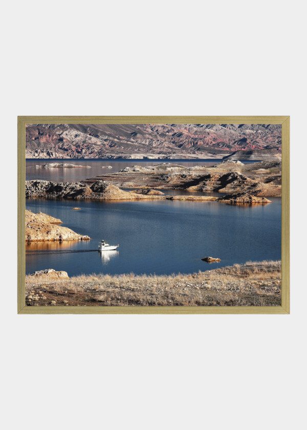 ROCKY MOUNTAINS, LAKE AND MOTORBOAT