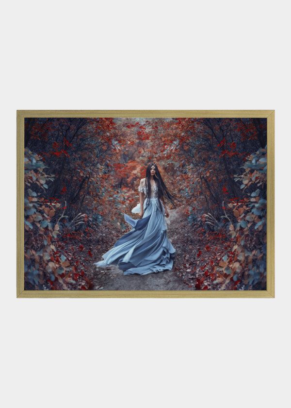 MODEL IN BLUE DRESS IN AUTUMN FOREST