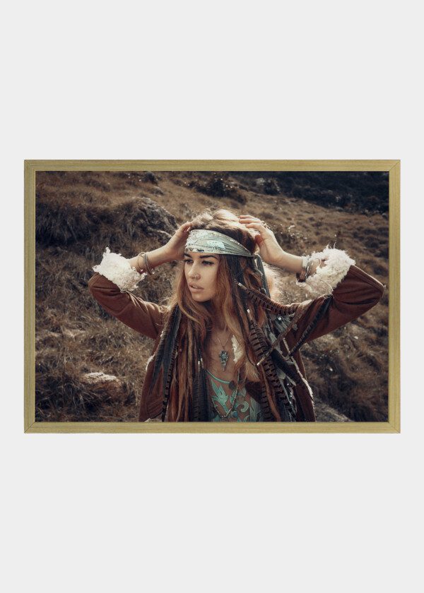 BOHO STYLE YOUNG WOMAN WITH HEADDRESS MADE OF FEATHERS