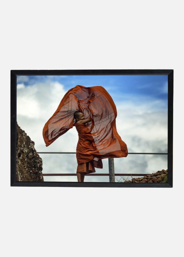 MONK IS WEARING CLOTHING FOR THE MONK OF BUDDHISM