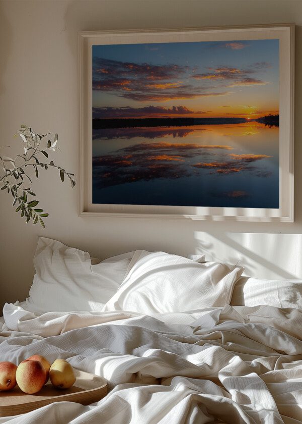 WATER REFLECTIONS AT MIDNIGHT SUN AT LAKE INARI IN FINLAND