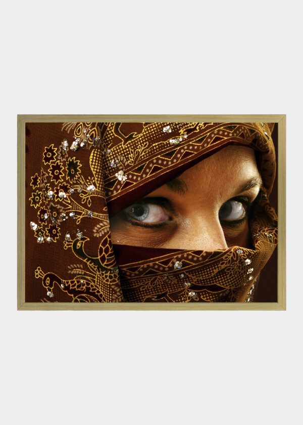 A BEAUTIFUL YOUNG WOMAN IN HEADRESS