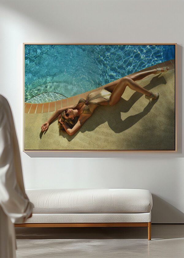 FASHION MODEL POSING PRETTY BY SWIMMING POOL