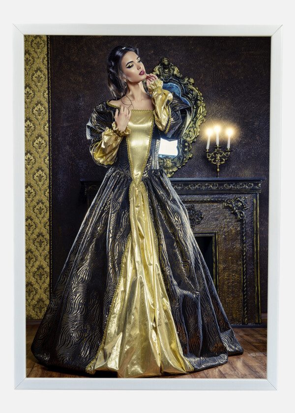 RENAISSANCE STYLE - BEAUTIFUL YOUNG WOMAN IN THE LUSH EXPENSIVE DRESS IN AN OLD PALACE