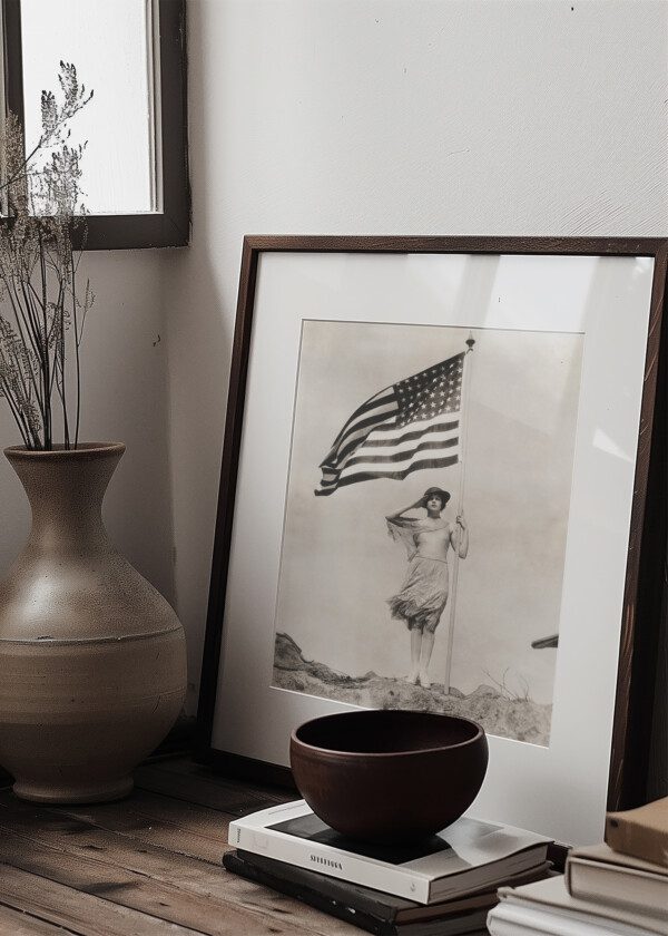 PATRIOTIC WOMAN HOLDING AMERICAN FLAG AND SALUTING