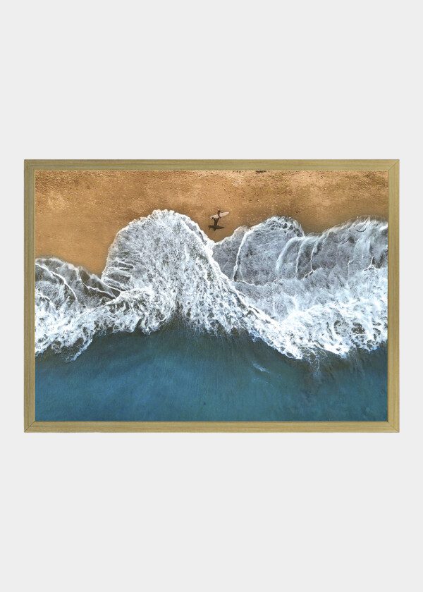 WAVES AGAINST BEACH EDGE