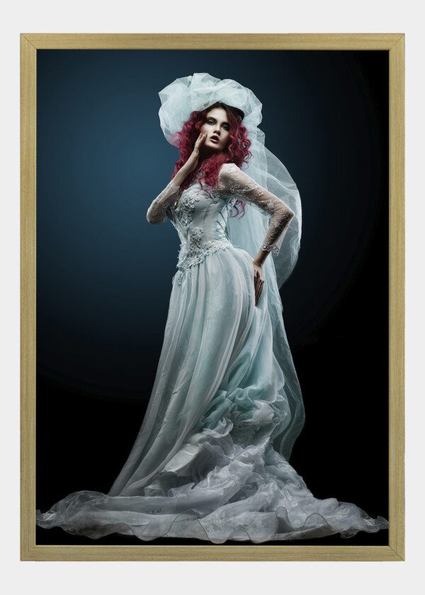 FULL-LENGTH SHOT OF A WOMAN IN A WEDDING DRESS WITH CLOTH ON A BACKGROUND