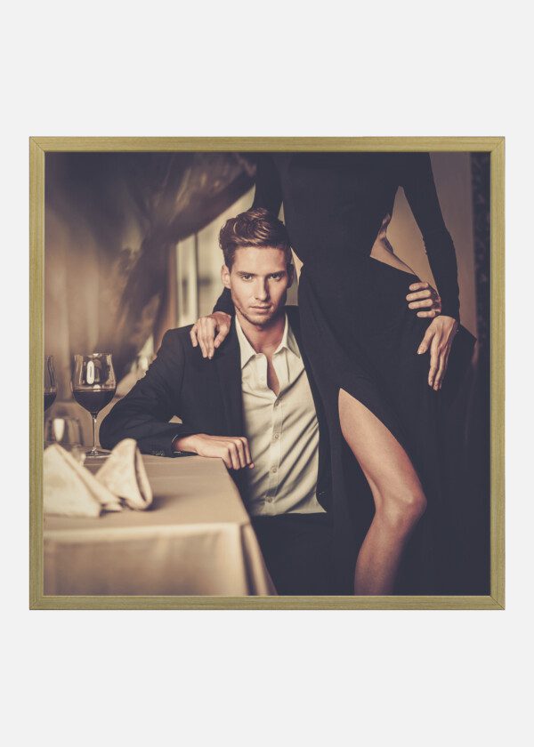 SEXY WELL-DRESSED YOUNG COUPLE IN LUXURY INTERIOR