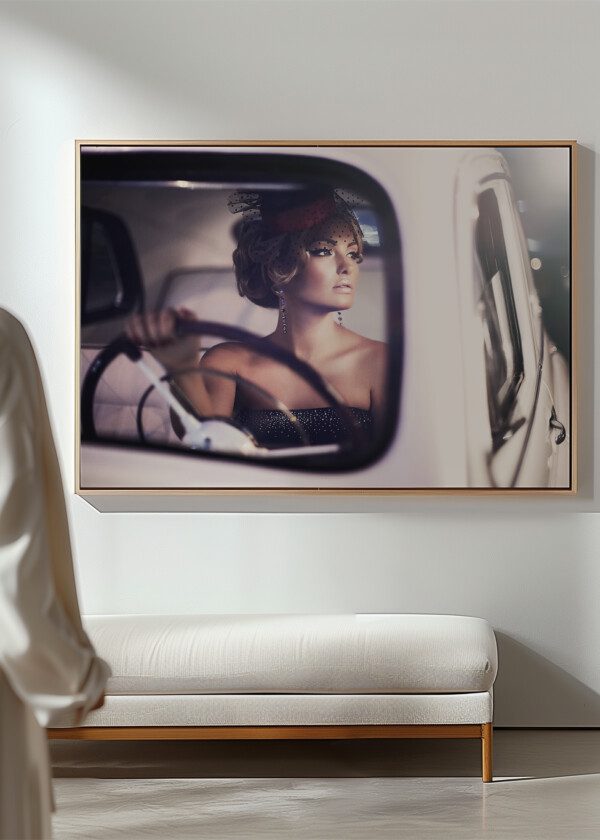 BEAUTIFUL SEXY FASHION BLOND GIRL MODEL WITH BRIGHT MAKEUP AND CURLY HAIRSTYLE IN RETRO STYLE SITTING IN OLD CAR