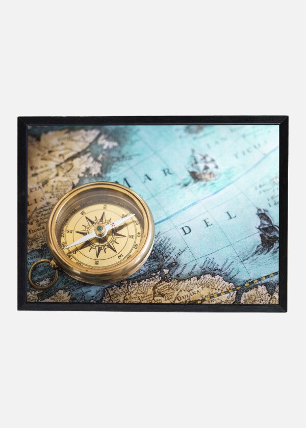 OLD COMPASS ON VINTAGE MAP. ADVENTURE STORIES BACKGROUND