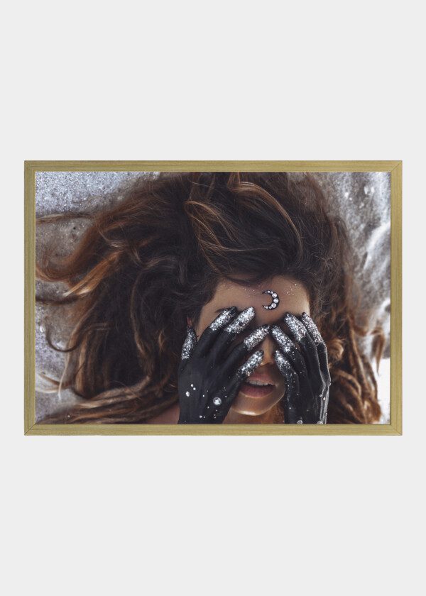 CLOSE UP OF BEAUTIFUL YOUNG WOMAN COVER EYES WITH HANDS PAINTED BLACK