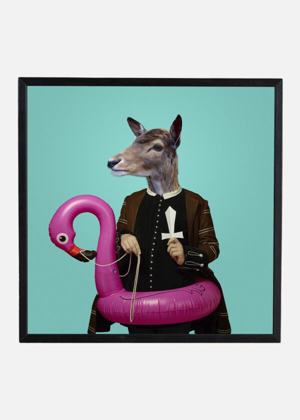 MODEL LIKE MEDIEVAL ROYALTY PERSON IN VINTAGE CLOTHING HEADED BY DEER HEAD ON BLUE BACKGROUND